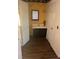 Small bathroom with dark vanity and wood-look floor at 5729 Dewsbury Ln, North Charleston, SC 29418