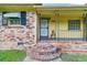 Brick ranch house with a covered porch and decorative railing at 1144 Old Mill Rd, Saint Stephen, SC 29479