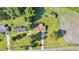 Aerial view of a house with a driveway and yard at 1144 Old Mill Rd, Saint Stephen, SC 29479