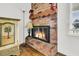 Cozy brick fireplace with decorative mantel in living room at 1144 Old Mill Rd, Saint Stephen, SC 29479