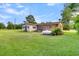 Brick and siding home exterior with propane tank and grassy yard at 1144 Old Mill Rd, Saint Stephen, SC 29479