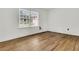 Empty bedroom with hardwood flooring and a window at 1144 Old Mill Rd, Saint Stephen, SC 29479
