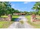 Brick ranch house with a long driveway and brick columns at 1144 Old Mill Rd, Saint Stephen, SC 29479