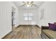 Bright living room with ceiling fan and wood-look floors at 1144 Old Mill Rd, Saint Stephen, SC 29479