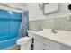 Bathroom with blue bathtub and a grey vanity at 1144 Old Mill Rd, Saint Stephen, SC 29479