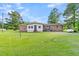 Ranch-style home with brick and siding exterior, and a large lawn at 1144 Old Mill Rd, Saint Stephen, SC 29479