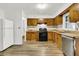 Kitchen with wood cabinets, gas range and dishwasher at 1144 Old Mill Rd, Saint Stephen, SC 29479