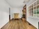 Living room features hardwood floors and a brick fireplace at 1144 Old Mill Rd, Saint Stephen, SC 29479
