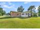 Ranch-style home with brick and siding exterior and large yard at 1144 Old Mill Rd, Saint Stephen, SC 29479