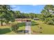 Ranch home with a spacious yard and detached garage, aerial view at 1144 Old Mill Rd, Saint Stephen, SC 29479