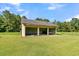 Two-car garage with block walls and a damaged roof at 1144 Old Mill Rd, Saint Stephen, SC 29479