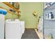 Laundry room with washer, dryer, and shelving for storage at 1144 Old Mill Rd, Saint Stephen, SC 29479
