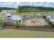 Community playground with wooden playset and ample green space at 4413 Palm Shadow Dr, Summerville, SC 29485