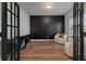 Study with a black accent wall and two comfy chairs at 4413 Palm Shadow Dr, Summerville, SC 29485