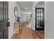 Bright entryway with hardwood floors and a console table at 4413 Palm Shadow Dr, Summerville, SC 29485