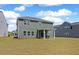 Large backyard with covered patio and green lawn at 4413 Palm Shadow Dr, Summerville, SC 29485