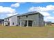 Spacious backyard with a covered patio and green lawn at 4413 Palm Shadow Dr, Summerville, SC 29485