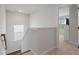 Upstairs hallway with staircase and access to bedrooms at 4413 Palm Shadow Dr, Summerville, SC 29485