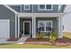Front porch of a two story home with rocking chairs at 4413 Palm Shadow Dr, Summerville, SC 29485
