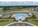Aerial view of community pool, clubhouse, playground, and parking at 4413 Palm Shadow Dr, Summerville, SC 29485