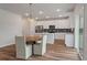 Modern kitchen with white cabinets and a breakfast bar at 4413 Palm Shadow Dr, Summerville, SC 29485