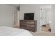Bright bedroom with dresser and view of en-suite bathroom at 4413 Palm Shadow Dr, Summerville, SC 29485