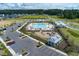 Aerial view of community pool, playground, parking and clubhouse at 4413 Palm Shadow Dr, Summerville, SC 29485