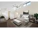 Main bedroom with high ceilings, wood floors, and ensuite bathroom at 2317 Tall Sail Dr # 1007 G, Charleston, SC 29414