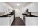 Modern kitchen with white cabinets, stainless steel appliances, and dark floors at 2317 Tall Sail Dr # 1007 G, Charleston, SC 29414