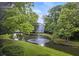 Peaceful pond view with lush landscaping and fountain at 2317 Tall Sail Dr # 1007 G, Charleston, SC 29414