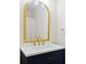Elegant bathroom with a navy vanity and gold accents at 2317 Tall Sail Dr # 1007 G, Charleston, SC 29414