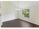Bright dining room with a chandelier and a view of the pond at 2317 Tall Sail Dr # 1007 G, Charleston, SC 29414