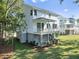 Two story home with white siding, gray accents, and a deck at 1203 Cecil Cir, Charleston, SC 29412