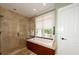 Spa-like bathroom with a large shower and a soaking tub at 3064 Marshgate Dr, Seabrook Island, SC 29455