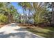 Home features a large driveway and lush landscaping at 3064 Marshgate Dr, Seabrook Island, SC 29455
