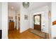 Bright entryway with hardwood floors and access to a half bath at 3064 Marshgate Dr, Seabrook Island, SC 29455