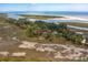 Aerial view of waterfront property with private dock and expansive marsh views at 3064 Marshgate Dr, Seabrook Island, SC 29455