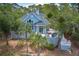 Two-story light blue home with large deck at 3064 Marshgate Dr, Seabrook Island, SC 29455