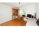 Bright office space with built-in corner desk and wood shelving at 3064 Marshgate Dr, Seabrook Island, SC 29455
