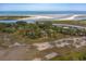 Private island home nestled amongst lush greenery with water views at 3064 Marshgate Dr, Seabrook Island, SC 29455