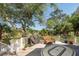 Relaxing deck with marsh views, wicker chair, and grill at 3064 Marshgate Dr, Seabrook Island, SC 29455