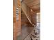 Wooden staircase with a modern design and natural light at 6024 Selkirk Plantation Rd, Wadmalaw Island, SC 29487