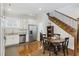 Eat-in kitchen with stainless steel appliances and hardwood floors at 291 Coming St, Charleston, SC 29403