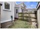 View of backyard with wooden fence and neighboring house at 291 Coming St, Charleston, SC 29403