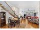 Small dining area with wooden table and chairs near the staircase at 291 Coming St, Charleston, SC 29403