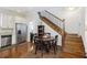Kitchen with white cabinets, stainless steel appliances, and hardwood floors at 291 Coming St, Charleston, SC 29403