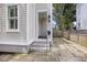 Front entrance with steps leading up to a small covered porch at 291 Coming St, Charleston, SC 29403