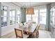 Bright dining room with a rustic wood table, and plenty of natural light at 407 Swaying Pine Ln, Summerville, SC 29486