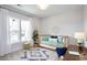 Charming office space with a daybed, desk, and large window overlooking the street at 407 Swaying Pine Ln, Summerville, SC 29486
