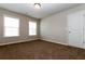 Bright bedroom with two windows, carpet, and neutral walls at 544 Alderly Dr, Moncks Corner, SC 29461